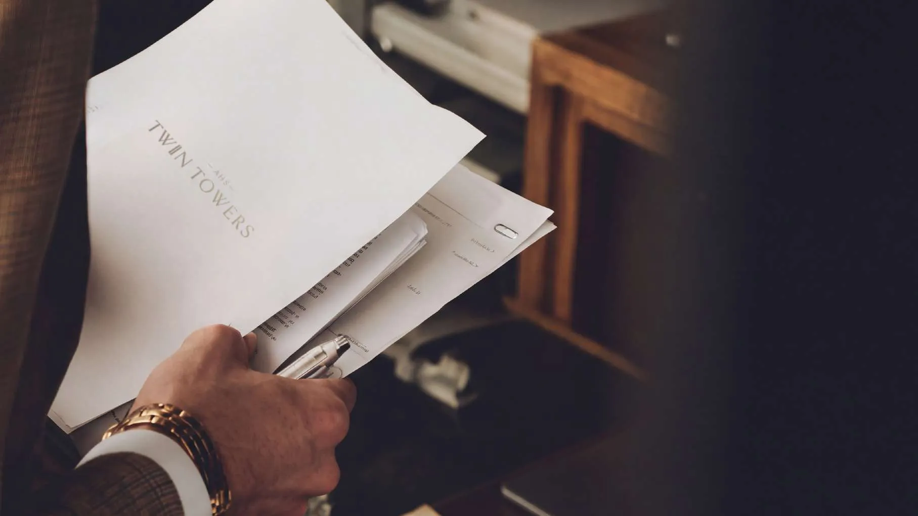 Executive reviewing documents in the business wing
